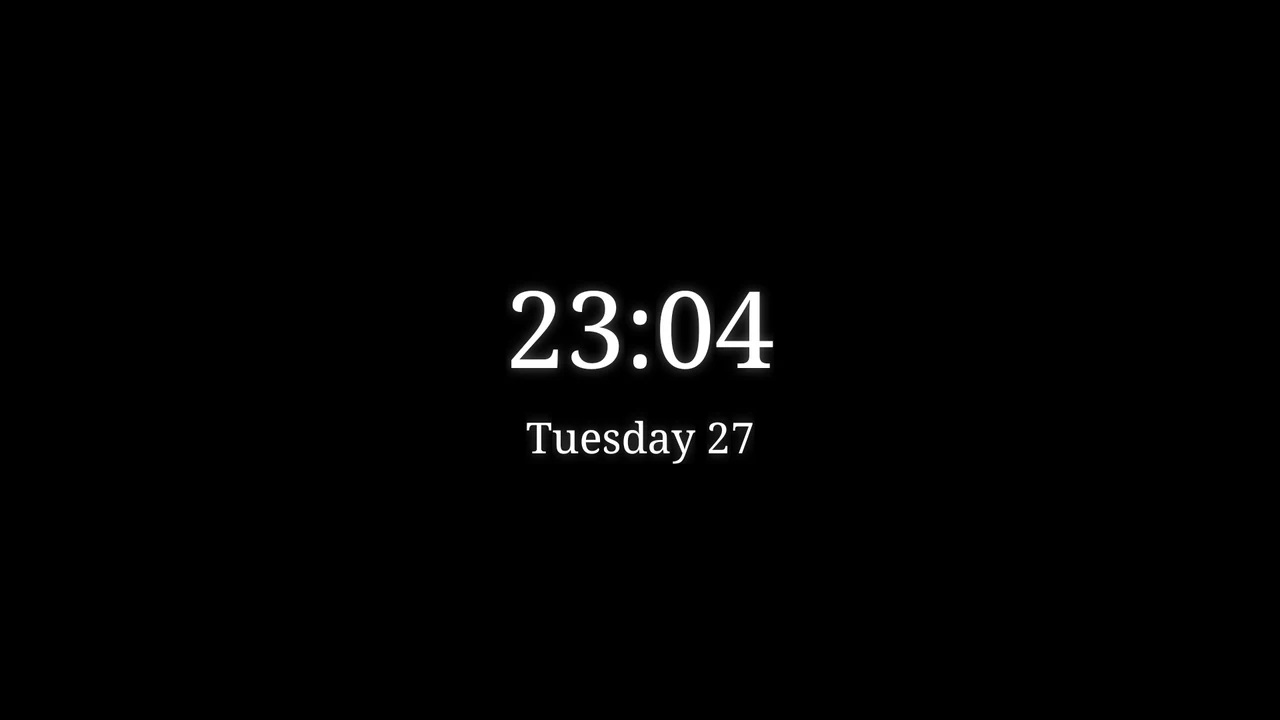 The Elegant native clock screensaver with white serif time and date on black